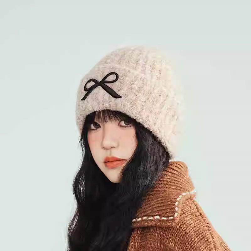 Hat women's autumn and winter wool hat new cute bow versatile cold hat ear protection warm knitted hat tide