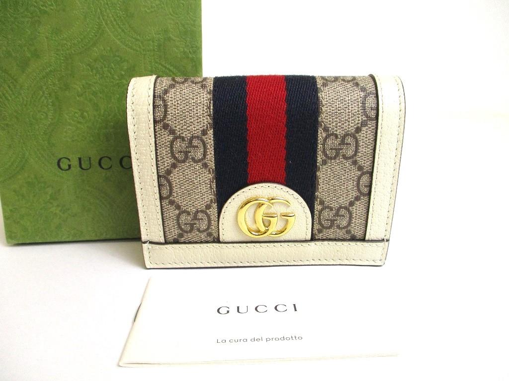 

Автентичний GUCCI GG Beige Leather White Leather Ophidia GG Bifold Wallet #a596 Refurbished
