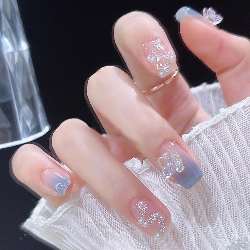 

Removable Milky Blue Bow Nail Patches Glue Type
