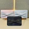 Celebrity high-end dinner bag single shoulder messenger bag small fragrant style bow banquet clutch bag woman
