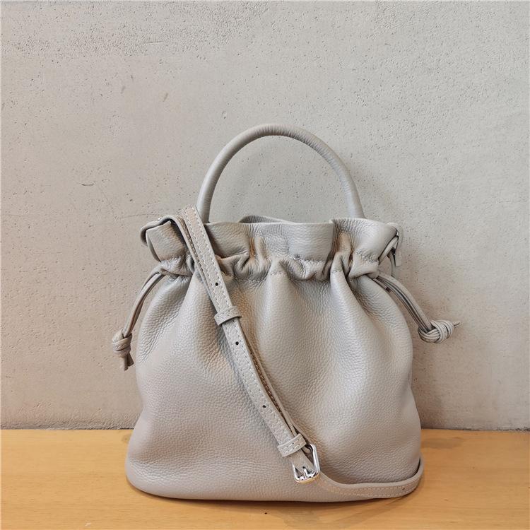 Women's Classic Fold Leather Bucket Bag: New Style, First Layer Cowhide, Trendy Solid Color Handheld Design