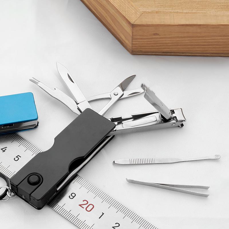 Popular Mini Multifunction Nail Beauty Tool: Folding Knife with LED, Scissors, and Clippers