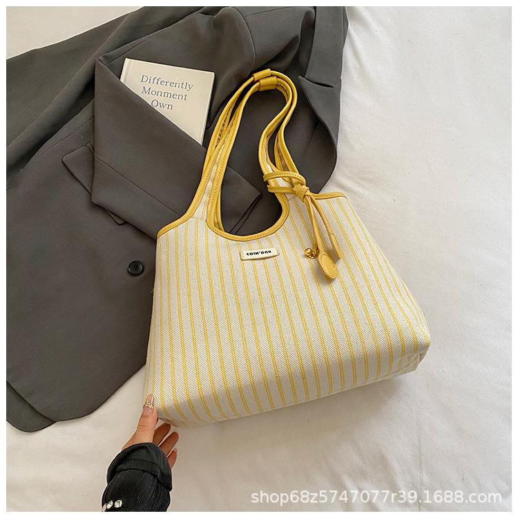 2025 lässige Pendler-Tragetasche Damen Nische gestreift schlicht Mode tragbare Umhängetasche große Kapazität Unterarmtasche