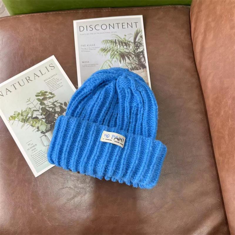 

Модная тканевая этикетка Вязаная шапка-баотоу Женская велосипедная дорожная универсальная защита ушей Пуловер Шерстяная шапка Casual versatile, warm and elastic