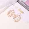 Ethnic Style Retro Hollow Leaf Stud Earrings - Banana Leaf Design for Women