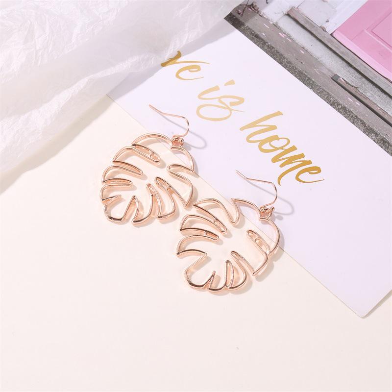 Ethnic Style Retro Hollow Leaf Stud Earrings - Banana Leaf Design for Women