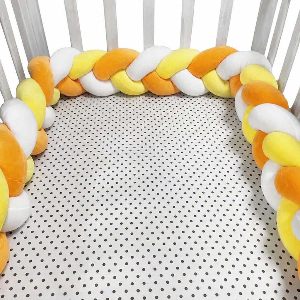 Three-strand knitted crib bumper, cable knit crib bumper