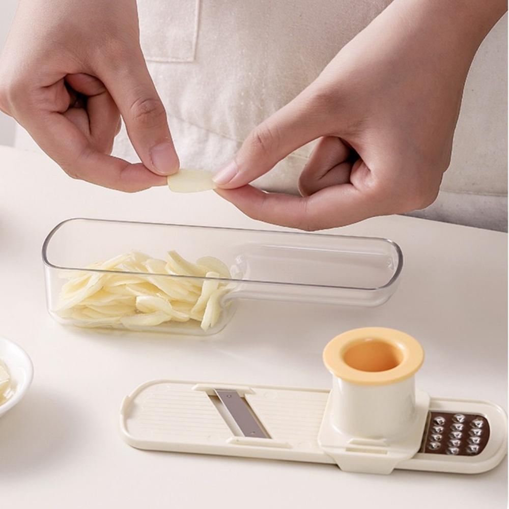 Three-in-one durable plastic manual household garlic mashing machine, grinder, shredder, multi-functional ginger and garlic tool