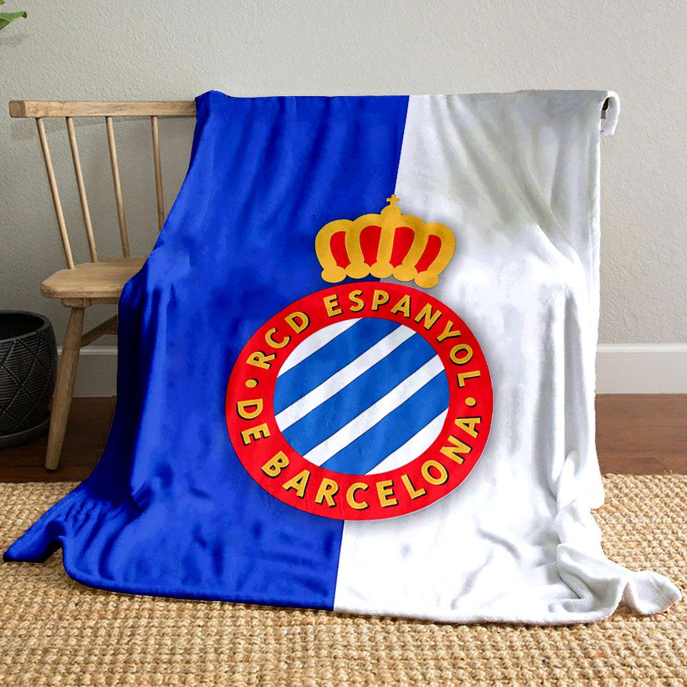A blue and white striped crest with a red circular border and gold crown. for all seasons blanket lunch break throw gift