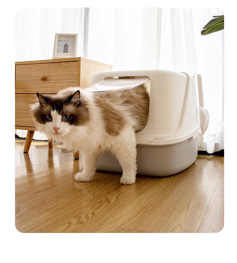 Uzavřená kočičí toaleta s odklápěcím víkem, deodorizační funkcí a lopatkou, odolná proti stříkající vodě a nadměrně velká pro snadné čištění
