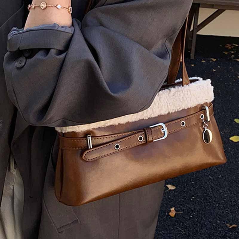 Lamb wool splicing shoulder bag women's 2025 autumn and winter new women's versatile commuter niche baguette armpit bag