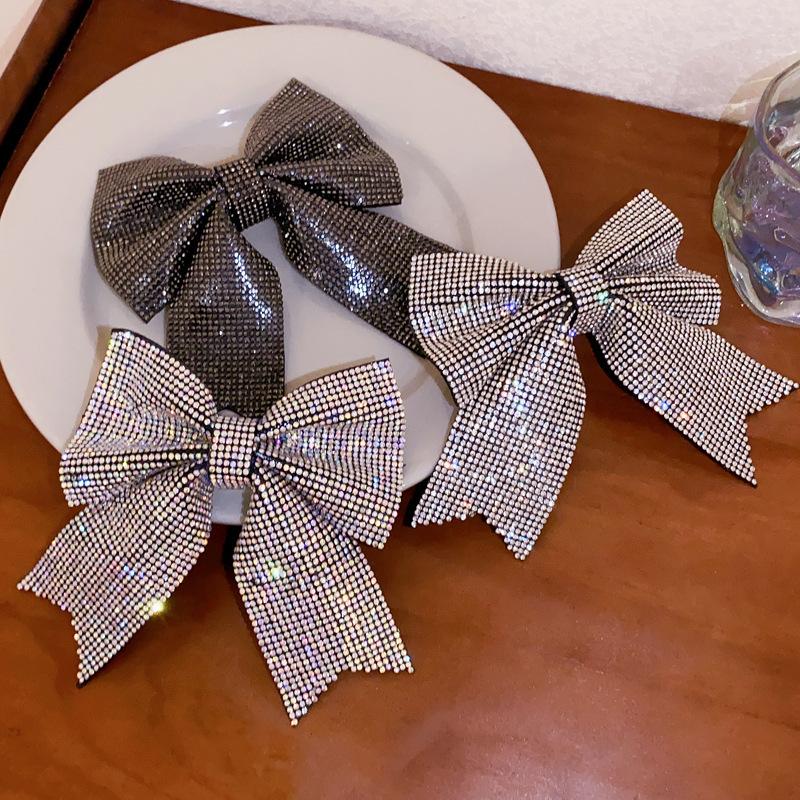 Korean version of fashion bow hairpin niche simple and versatile temperament spring clip advanced semi-drape hairpin