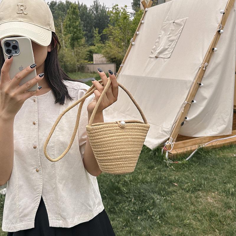 2025 new pearl buckle silk scarf women's bag handwoven messenger bag beach feng shui bucket straw bag
