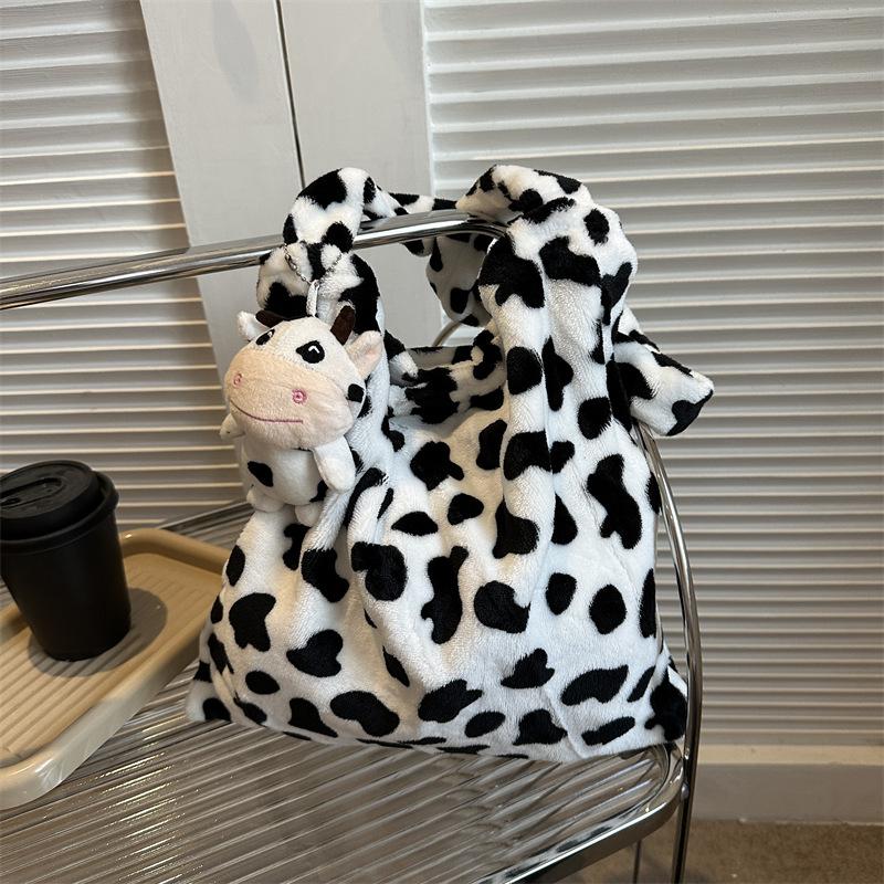 2025 Early Spring New Large Capacity Plush Trend Cow Pattern Personality Student Class Shoulder Bag Female Design Sense