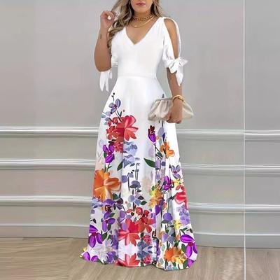 Vestido estampado de primavera y verano temperamento sin tirantes manga corta con cuello en V estampado un gran swing