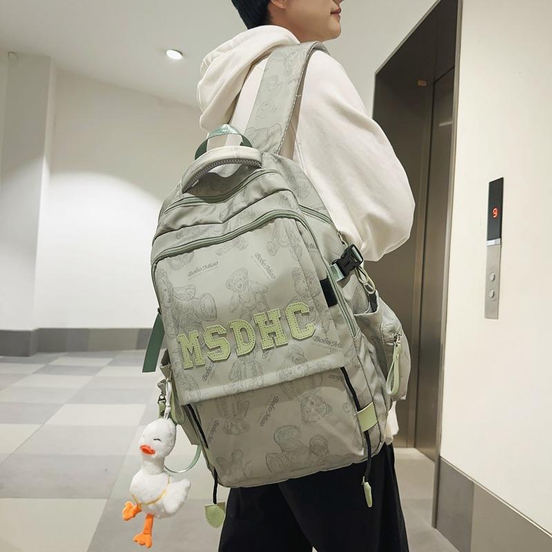 

School bag for female junior high school students, simple and versatile printed bear niche design 2025 new college student computer backpack for men single bag зелёный