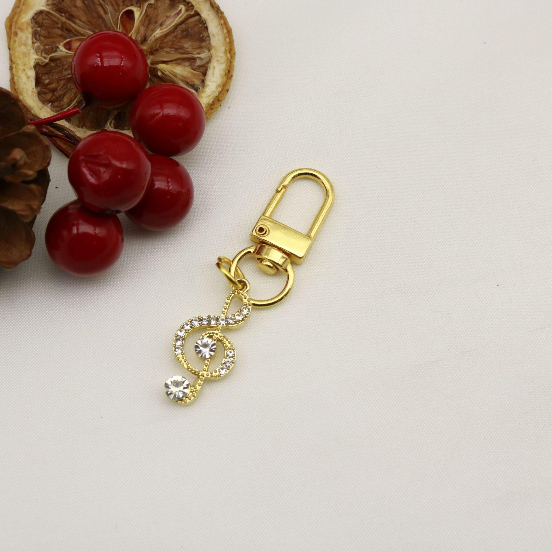 Rhinestone Inlaid Musical Note Keychain Pendant Jewelry золотой