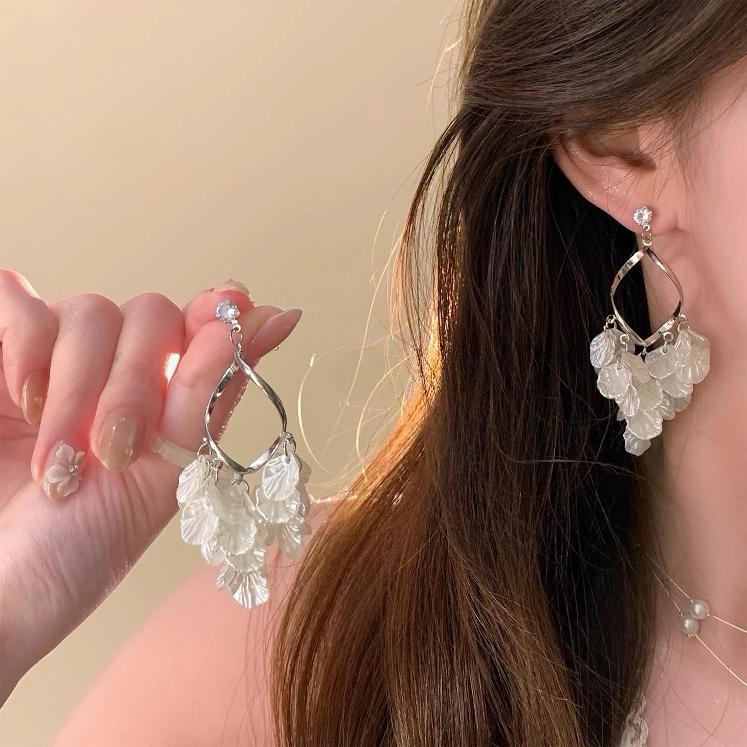 

French shell petal fringed earrings women s light luxury niche stud earrings high-end sense no pierced earrings holiday style earrings