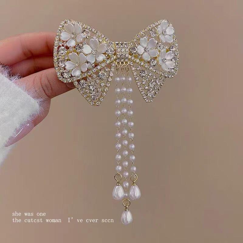 Pince à cheveux papillon à pampilles perle rouge automne/hiver 2025 pour femmes