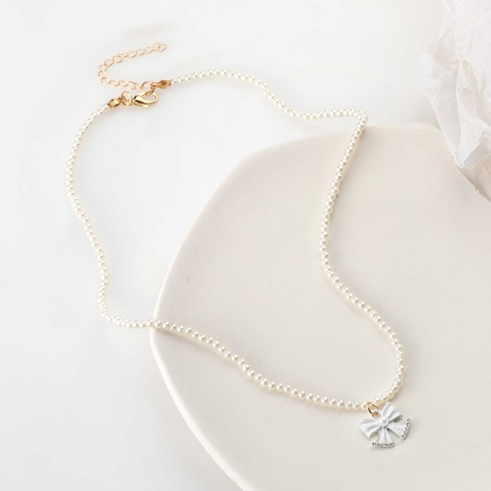 

Fashion Necklace, Fresh And Cute Pearl Necklace, Bow Point Diamond Pendant, Necklace Item.