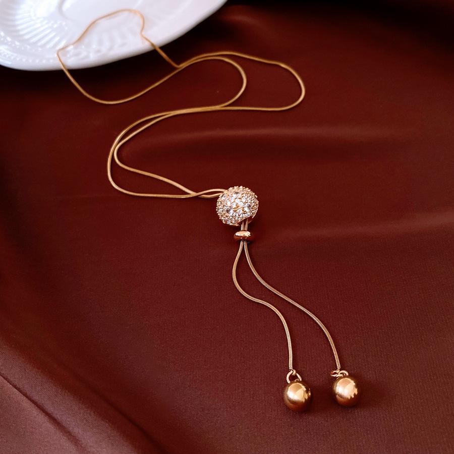 

Покрытое настоящим золотом круглое выдвижное ожерелье с бахромой, легкая роскошь, нишевая цепочка для свитера, ожерелье высокого класса