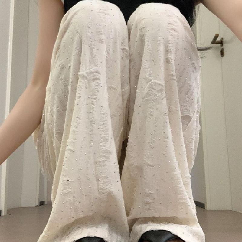 Off - White Roztrhané a kamínky zdobené ležérní kalhoty pro ženy - Jarní/podzimní splývavé zeštíhlující ležérní kalhoty po zem se širokými nohavicemi