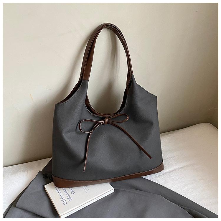 Retro commuter niche bow single shoulder armpit bag 2025 Korean version new fashion simple contrasting color tote bag
