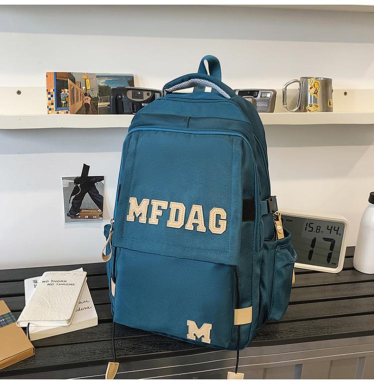 

Школьный рюкзак 2025 Новый Большой вместимости Универсальный Однотонный с буквой Многосекционный Рюкзак для ученика средней школы Высокой ценности Легкий синий