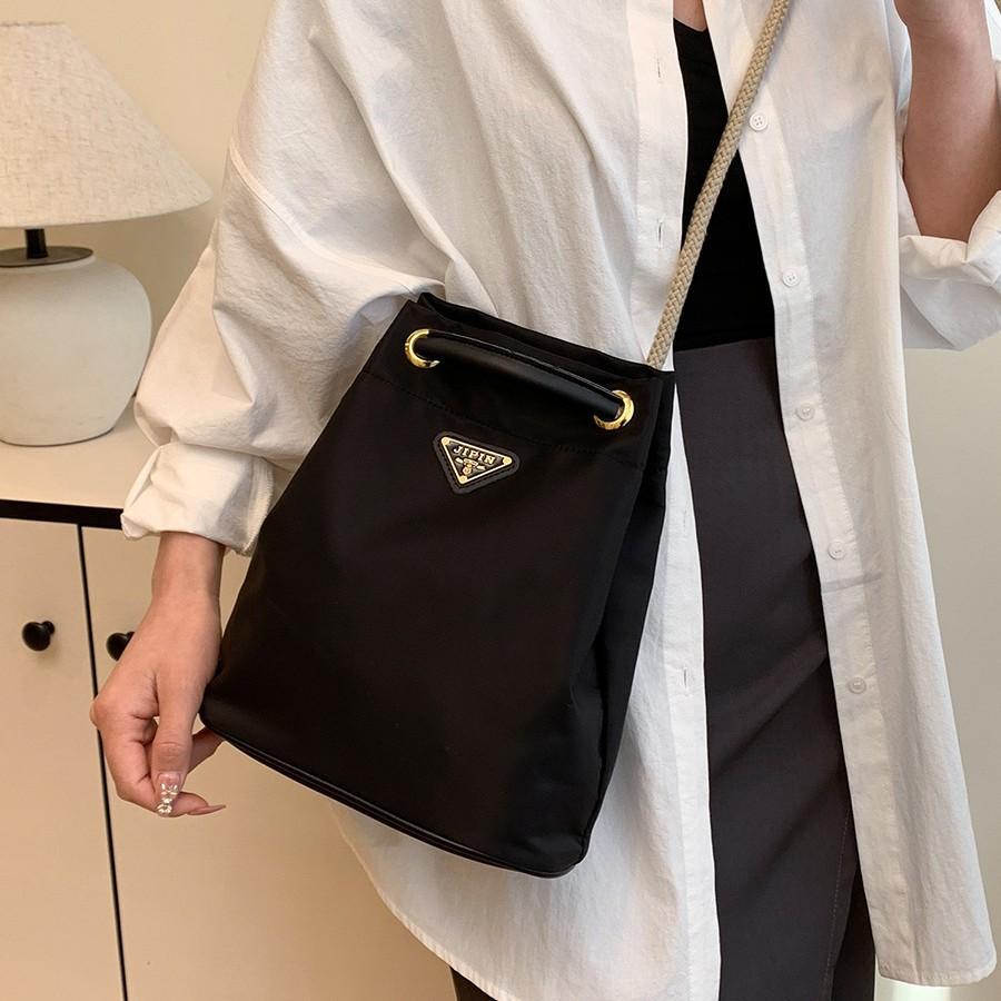 Versatile New Triangular Standard Nylon Canvas Bag Mini Niche Bucket Bag Double Chain Drawstring Single Shoulder Handbag Women