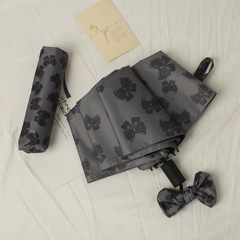 Women's Bow Sun & Rain Dual-Use Automatic Folding Umbrella - Compact, Fresh Sunshade with Black Glue for Sunscreen Protection.
