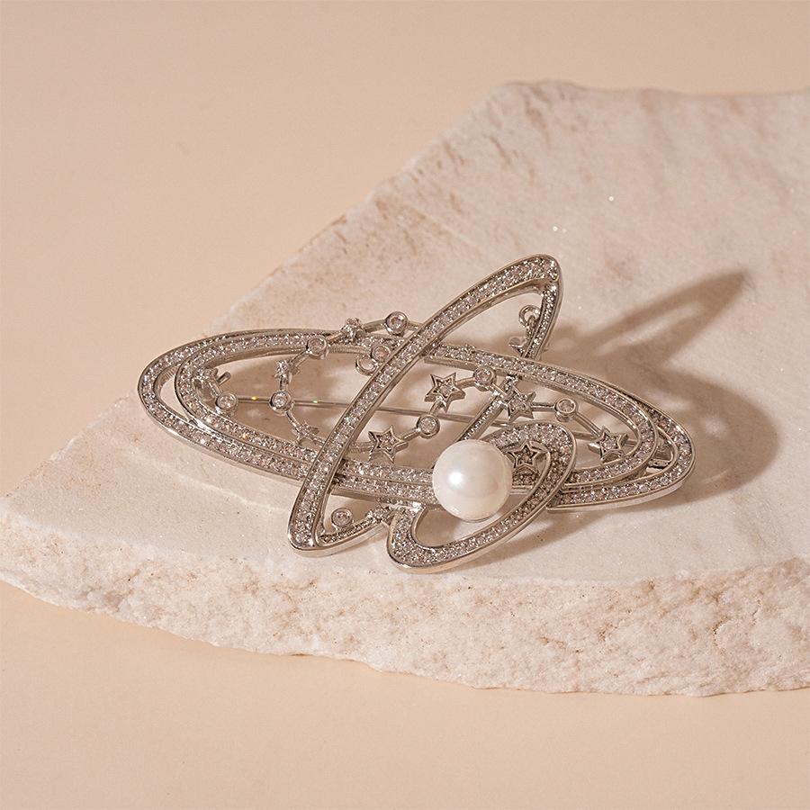 European and American metal feeling knotted zircon Saturn planet brooch a cold wind pin corsage girl