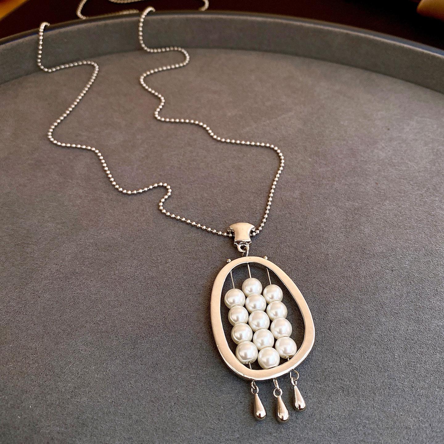 Korean oval hollow water drop fringed pearl necklace light luxury sweater chain temperament versatile necklace