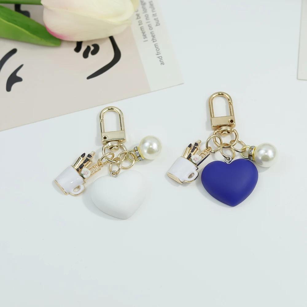 Bunte herzförmige Schlüsselanhänger mit Perlenstift-Behälter-Anhänger Schlüsselring Damen Geldbörsen-Taschen-Ornamente Auto-Schlüsselhalter-Zubehör