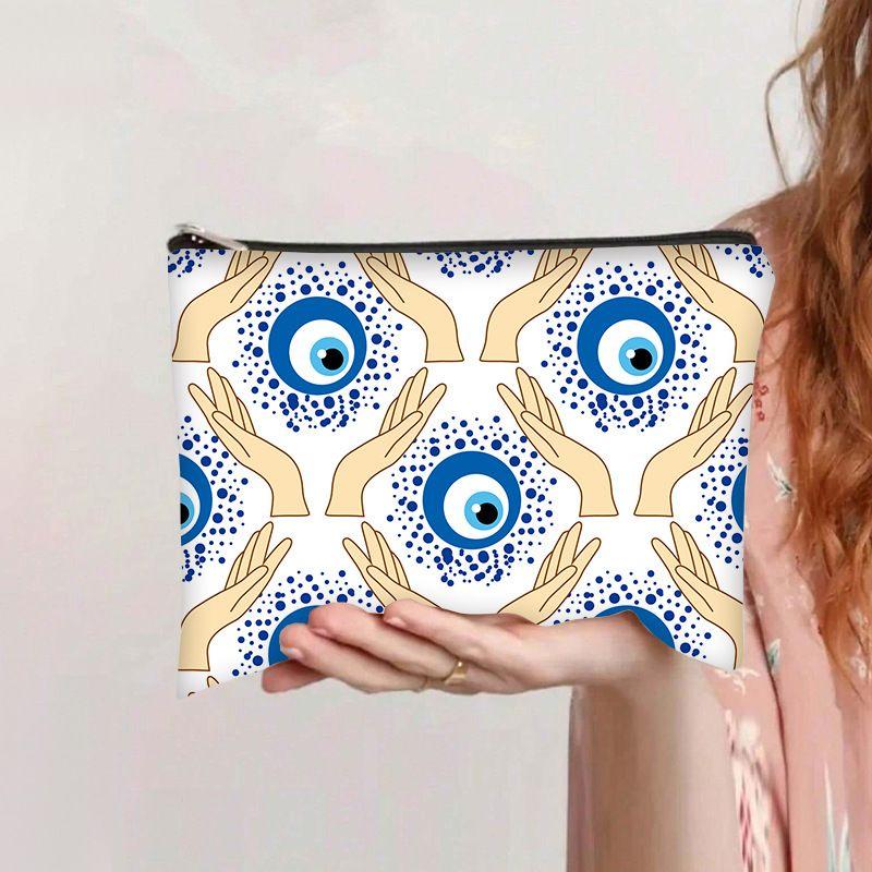 Printed devil's Eye cosmetic bag, travel storage bag, high-value women's clutch bag, wash bag
