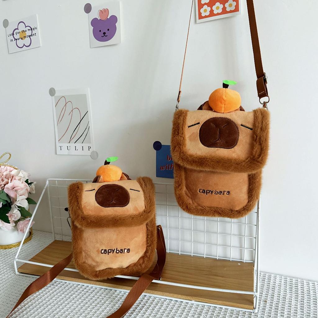 Cartoon cute orange capybara doll messenger bag furry small square bag cute kapibara mobile phone storage bag