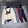 Saint Family - 2025 Autumn/Winter Plaid Bow V-Neck Knit Cardigan with Brooch: Age-Reducing, Loose, Versatile Top.
