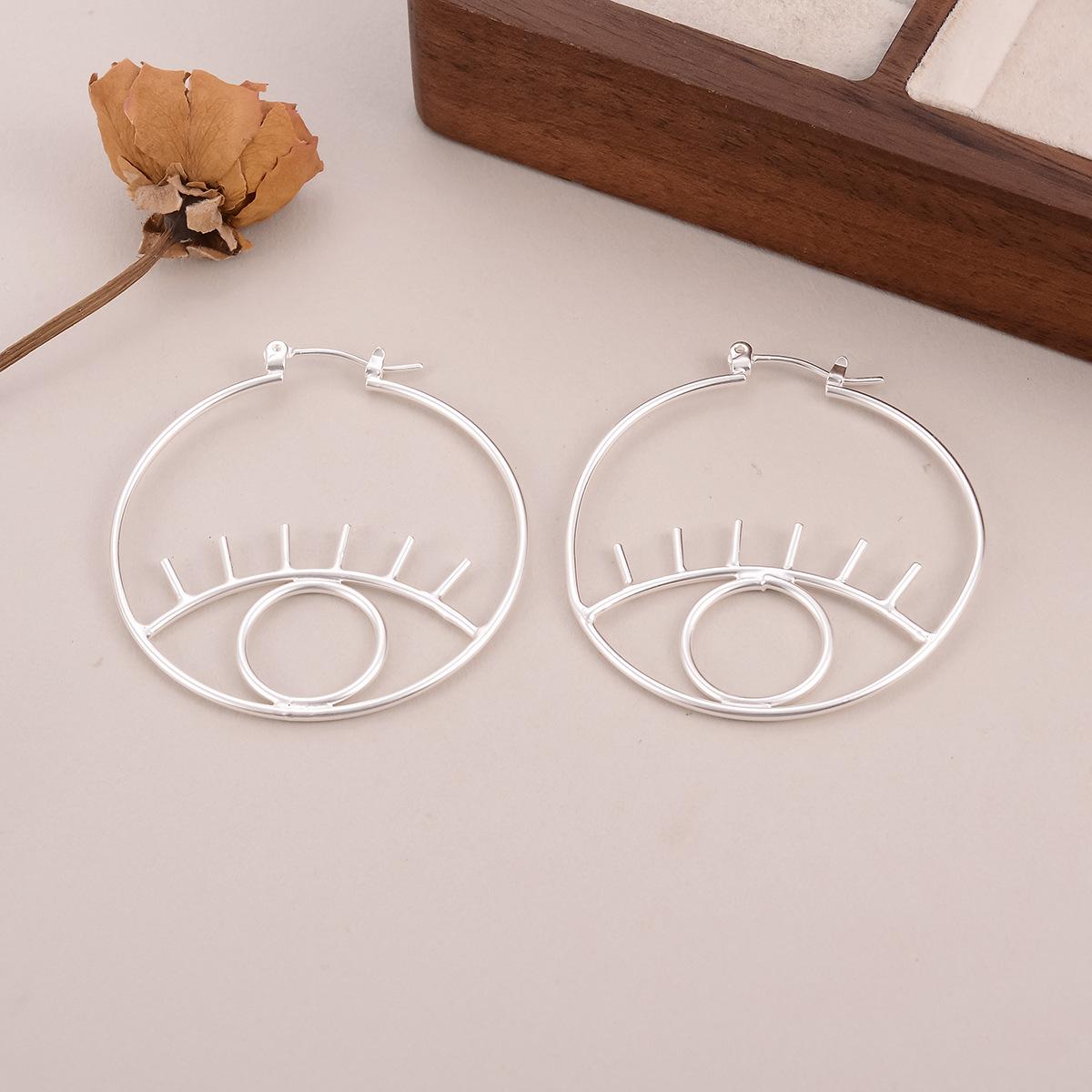 

European and American popular devil s eye earrings, cold circles, exaggerated earrings, cross-border earrings, simple fashion accessories