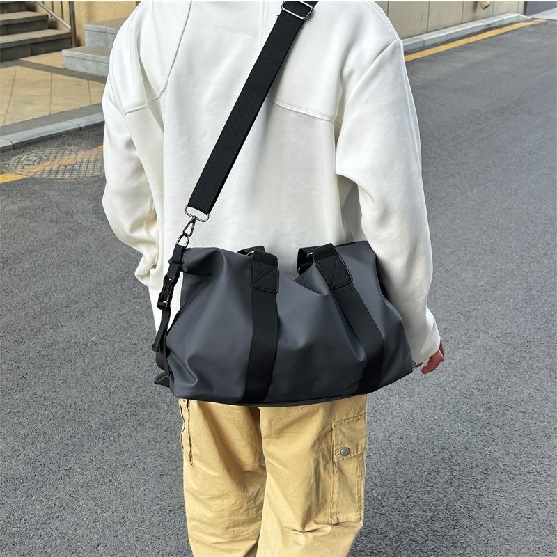 A Large-capacity Water-resistant Travel Bag Carried By A Man, A Single-shoulder Crossbody Luggage Bag and A Storage Bag