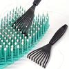 A Single Pack of Plastic Mini Comb Cleaner with Embedded Bristles a Hair Removal Tool for Home Use Featuring a Handle
