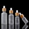 Tomma droppflaskor av glas Ögonpipett Trä Bambu Lock eteriska oljor 5Ml-100Ml