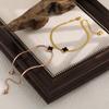 European Light Luxury Four-Leaf Clover Anklet, Titanium Steel Snake Bone Chain, Gold Beach Foot Jewelry for Women.