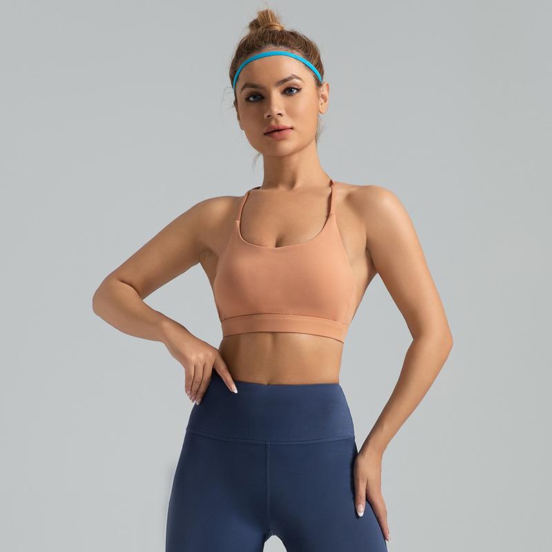 Wysoce elastyczny sportowy biustonosz typu halter z wbudowaną wkładką na biust do jogi i fitnessu