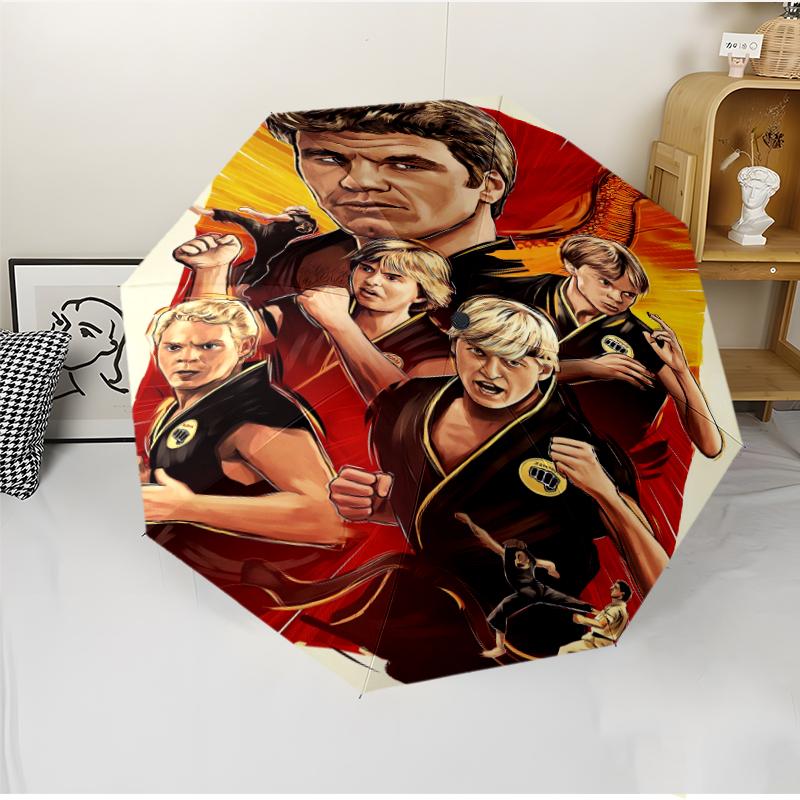 Cobra Kai Fashionable Automatic Opening/Closing Folding Umbrella. Portable and Foldable, Ideal for Gift, Travel, and Daily Use.