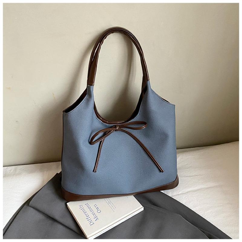 Retro commuter niche bow single shoulder armpit bag new fashionable and simple contrasting color tote bag