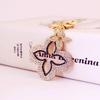 Exquisite Four-Leaf Clover Alloy Keychain Charm - Perfect Gift for Girlfriend, Bag Accent, or Keyring Accessory.