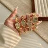 Goldene Damenuhr neue Mode Quarzuhr Pendler vielseitige Uhr Retro kleine Golduhr
