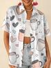 Gentle blue floral printed shirt for women, short-sleeve loose lapel design, niche vacation style top