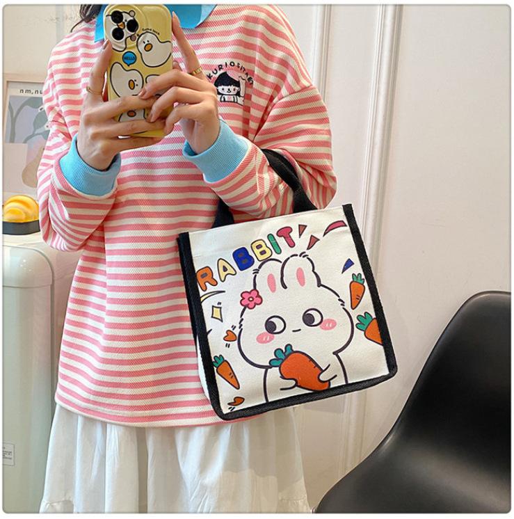 Japanese cute canvas bag bunny printed cartoon less tutoring bag go out hand carry bento bag wholesale