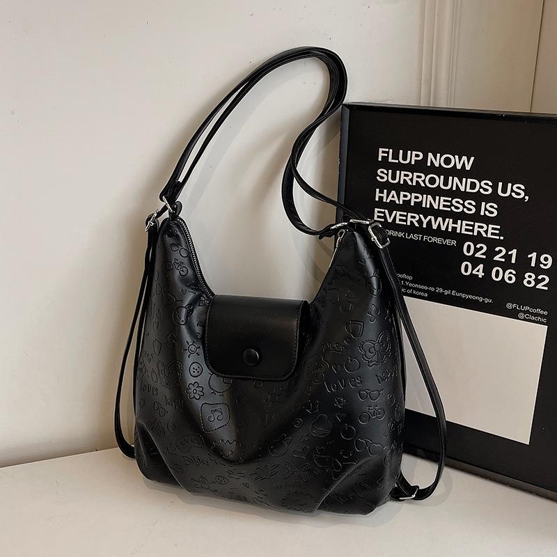 High-quality new niche cute graffiti embossed large-capacity tote bag light casual soft leather multi-back shoulder bag
