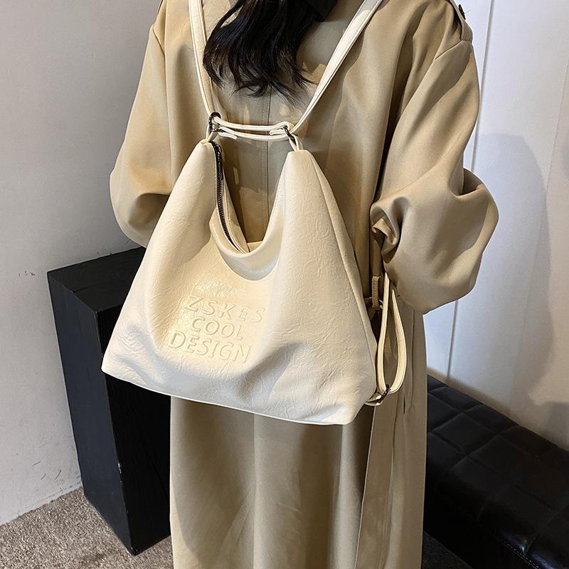 

Новый продукт, простой стиль, продвинутая текстура, нишевая корейская сумка-тоут, женский многофункциональный способ ношения, легкий рюкзак для поездок на работу 33*11*30 белый